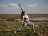 Georgie in reverse warrior pose at Elmley nature reserve, yoga teacher