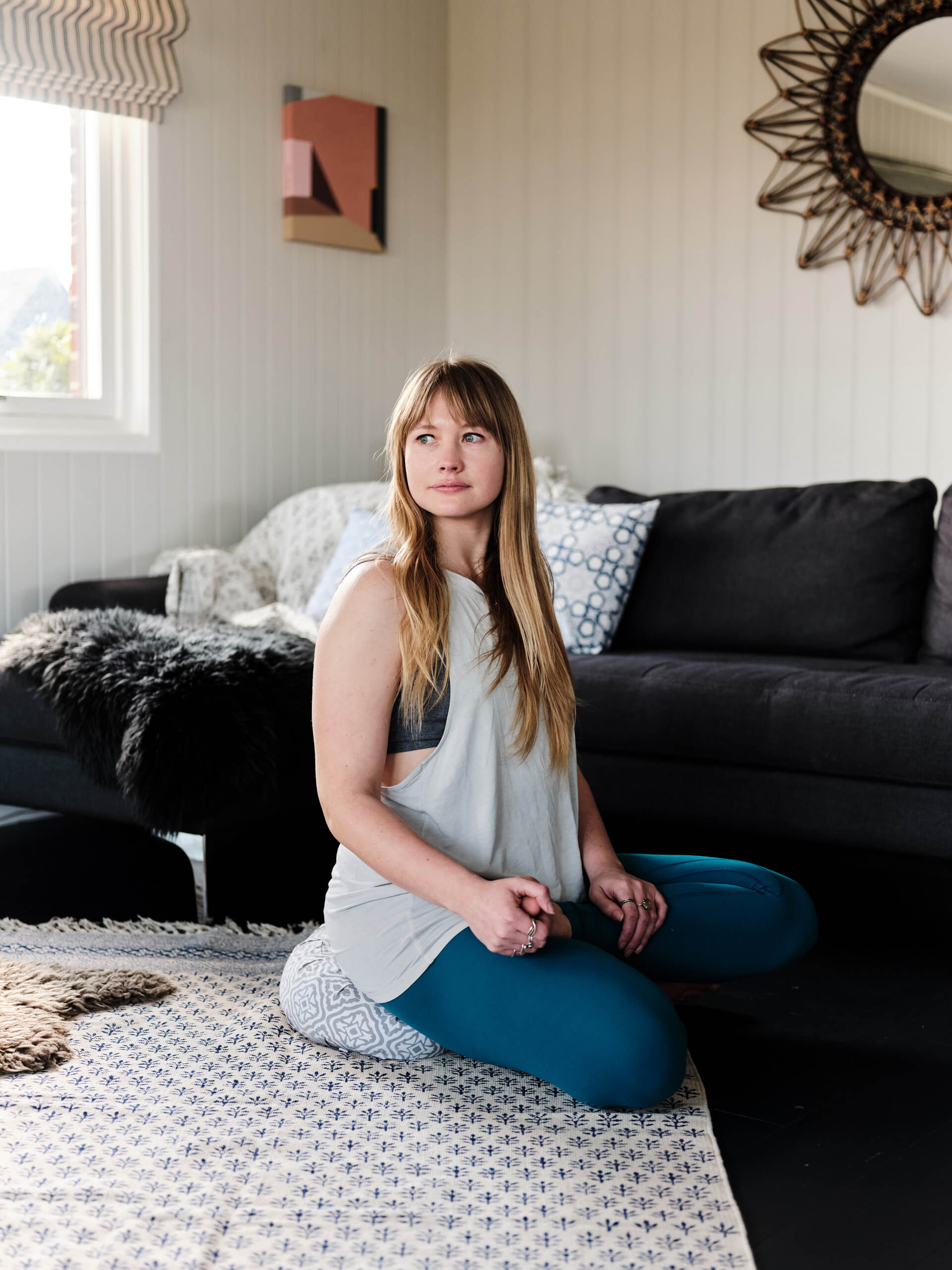 Yoga Teacher, Georgie Davies, sits on Yogipod meditation cushion