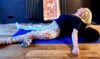 Mische Howard in a restorative back bend using a yoga bolster