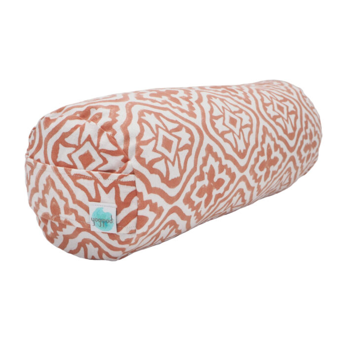 A mini bolster for relaxation made by Yogipod in a Tiled Lattice design in Jaipur Pink