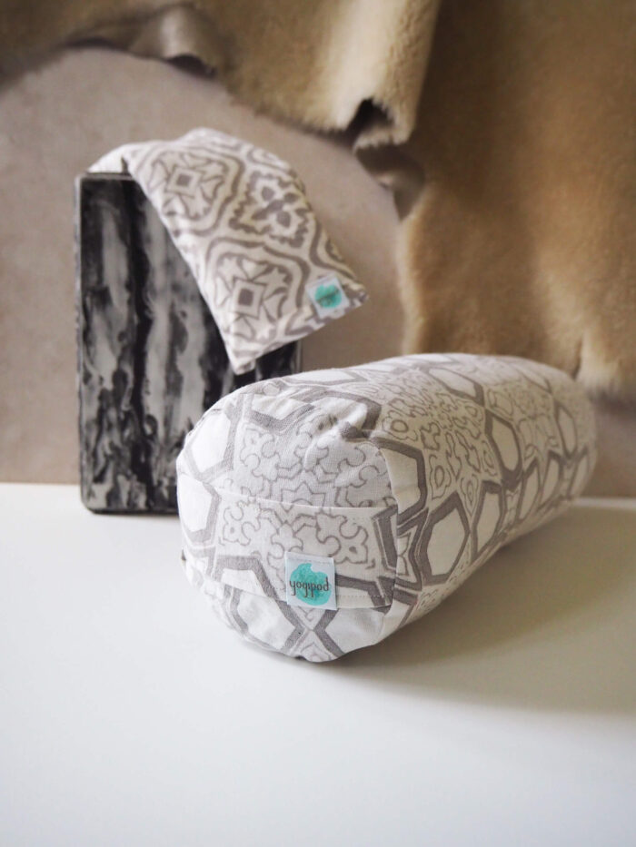 Hand printed mini bolster from Yogipod in a grey fretwork design