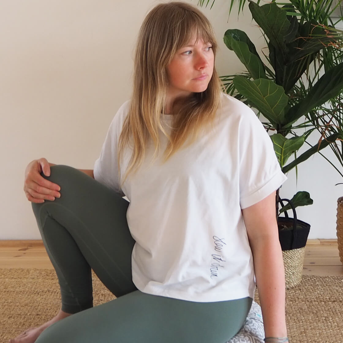 Yogipod founder Georgie wears the Slow it Down tee