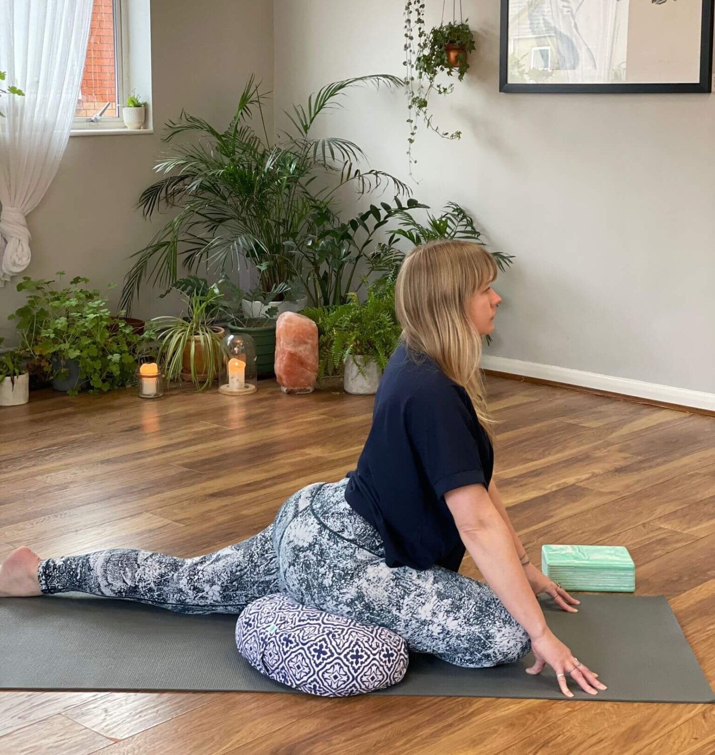 Georgie uses a Yogipod meditation cushion to support pigeon pose